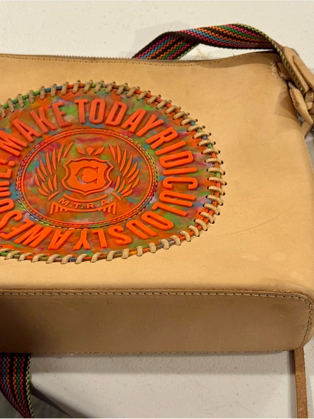 Consuela Beige Leather Crossbody with Multicolor Medallion